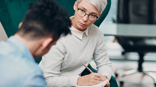 a therapist talks to a man at a hepititis c treatment program at positive pathways in pennsylvania