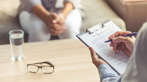 a woman talks to a doctor about medication assisted treatment programs at positive pathways in pennsylvania