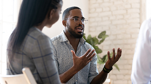 a man talk to a group of people about outpatient rehab programs at positive pathways in pennsylvania